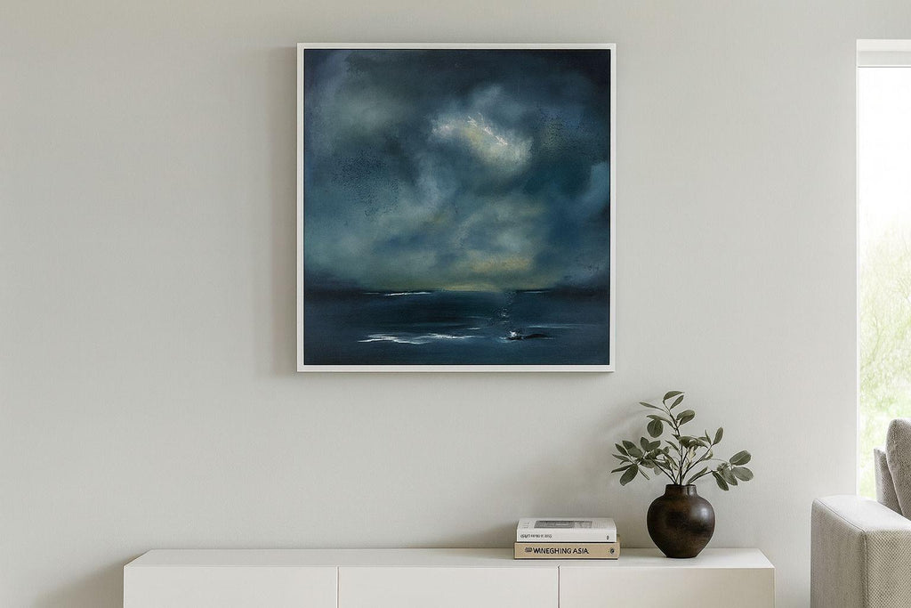 Framed artwork of a stormy sky over water in a modern living room.